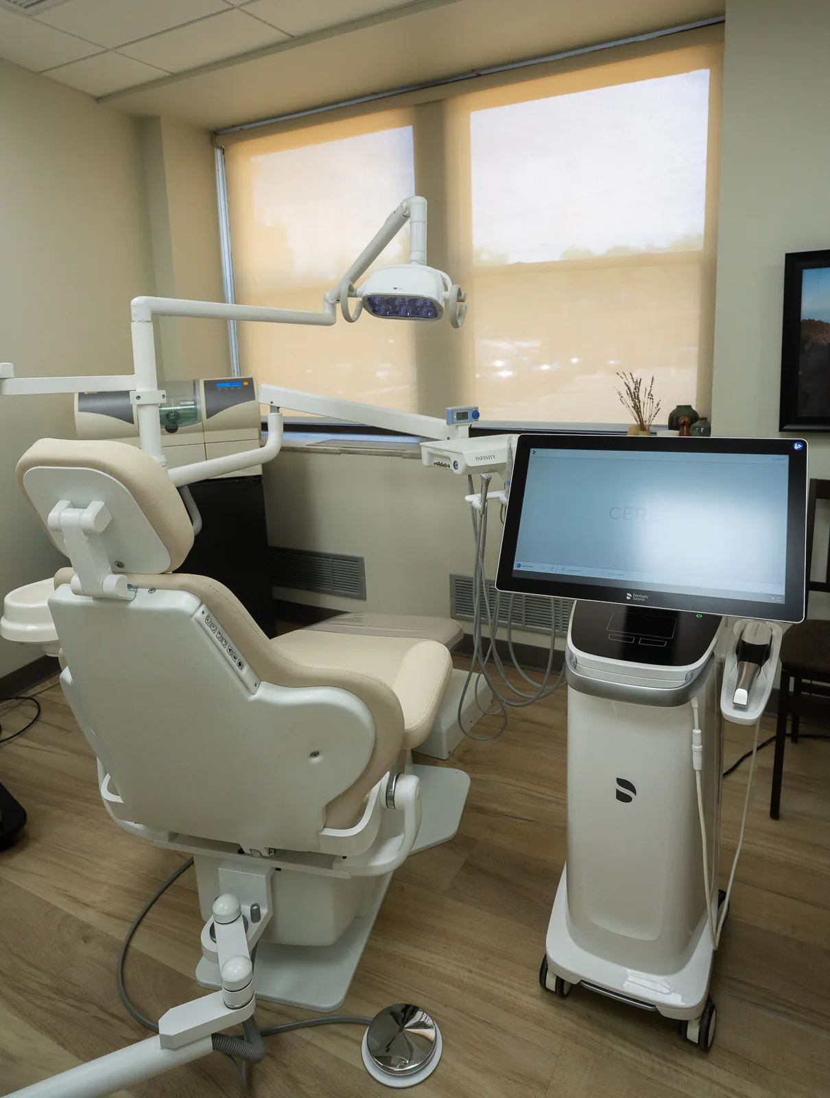 Treatment room at the Scarsdale office with the CEREC acquisition unit beside the chair